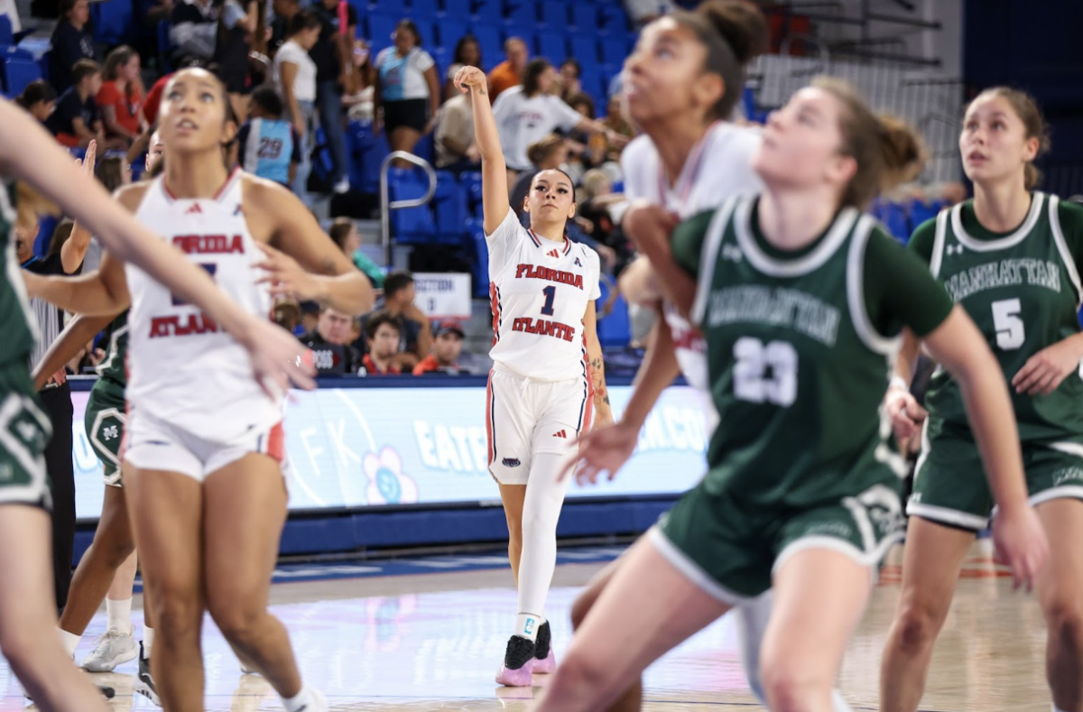 Guard Mya Perry shooting a three-pointer in the opening game for the FAU Thanksgiving Classic vs. Manhattan